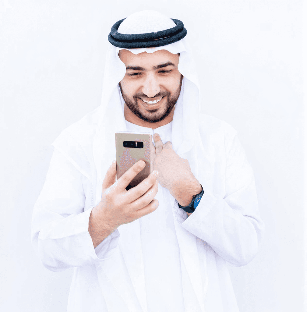 Muslim man using his phone